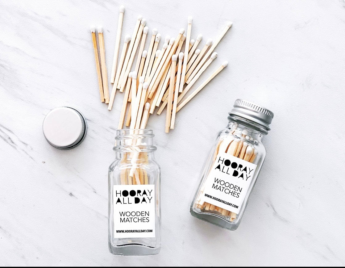 White matches in glass jar with striker on the back